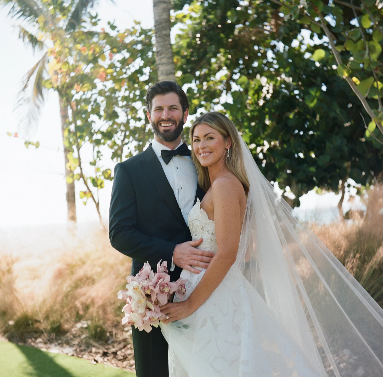 Bride and groom in a coastal wedding portrait